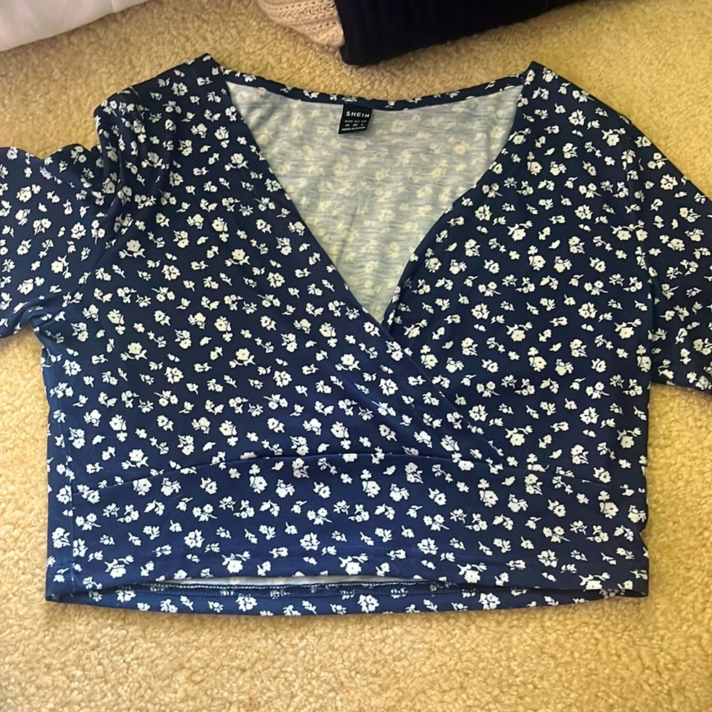 This is a mid crop top! Very cute! Low neck as well
